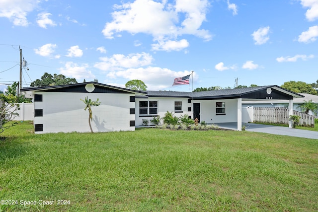 ranch-style home featuring a front yard