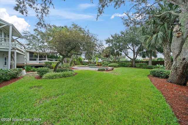 view of yard featuring a pool side deck