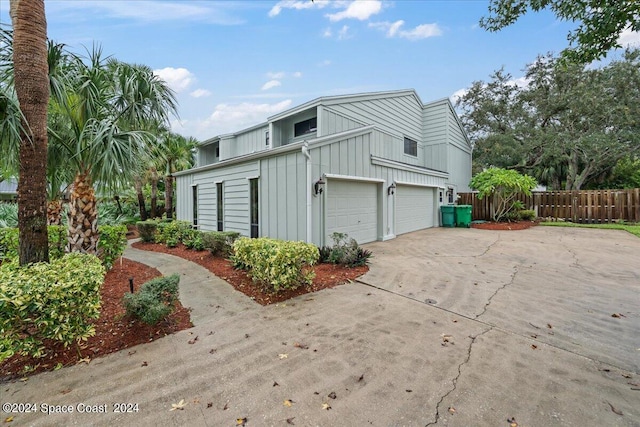 view of side of property with a garage