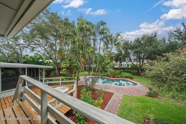 view of pool with a sunroom