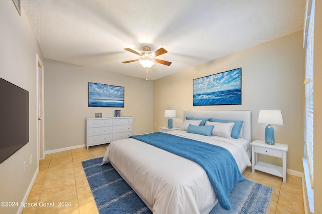 tiled bedroom with ceiling fan