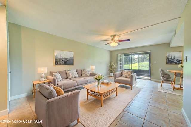 tiled living room with ceiling fan