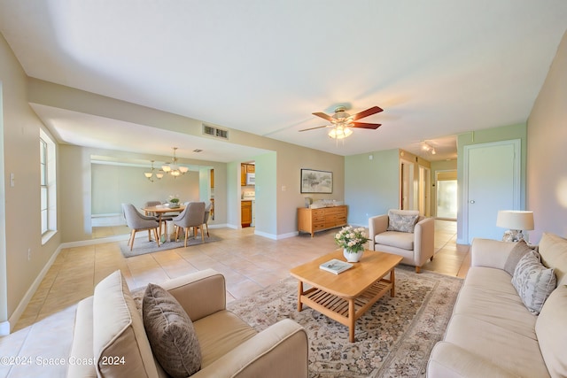 tiled living room with ceiling fan