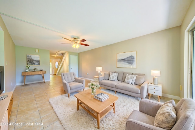 living room featuring ceiling fan and light tile patterned flooring