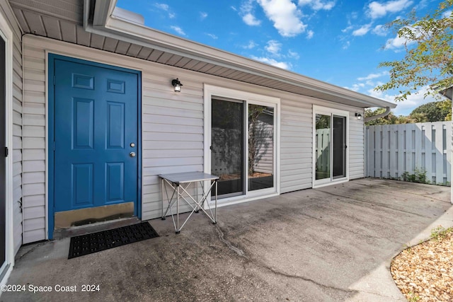 property entrance with a patio