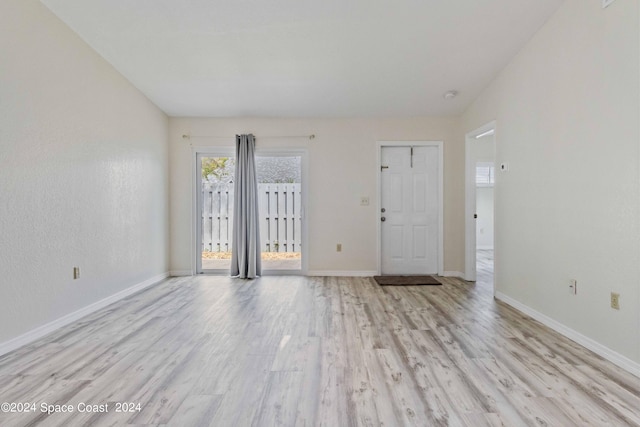 foyer entrance with light hardwood / wood-style flooring