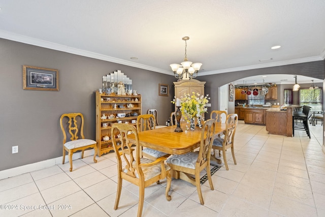 tiled dining area with ornamental molding and a chandelier