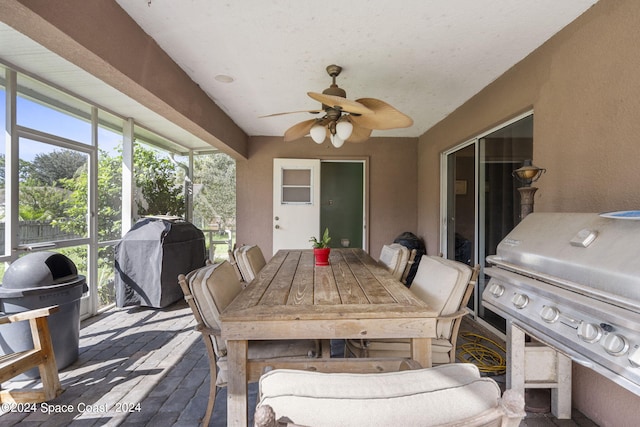 view of patio / terrace featuring ceiling fan and grilling area