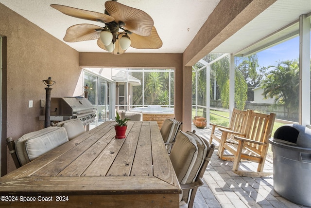 sunroom / solarium with ceiling fan