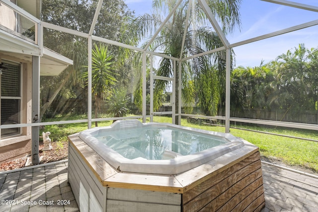 sunroom / solarium with a wealth of natural light and a jacuzzi