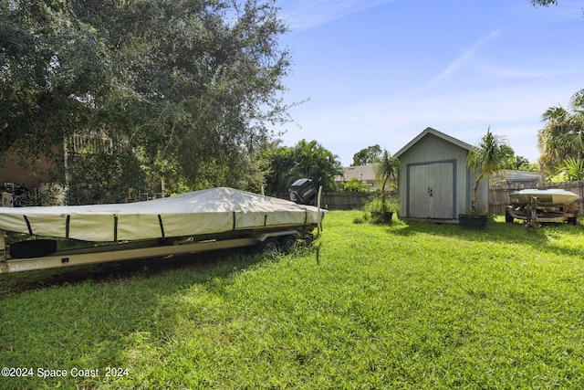 view of yard featuring a storage unit