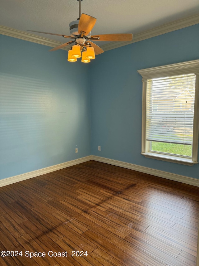 spare room featuring ornamental molding and wood-type flooring