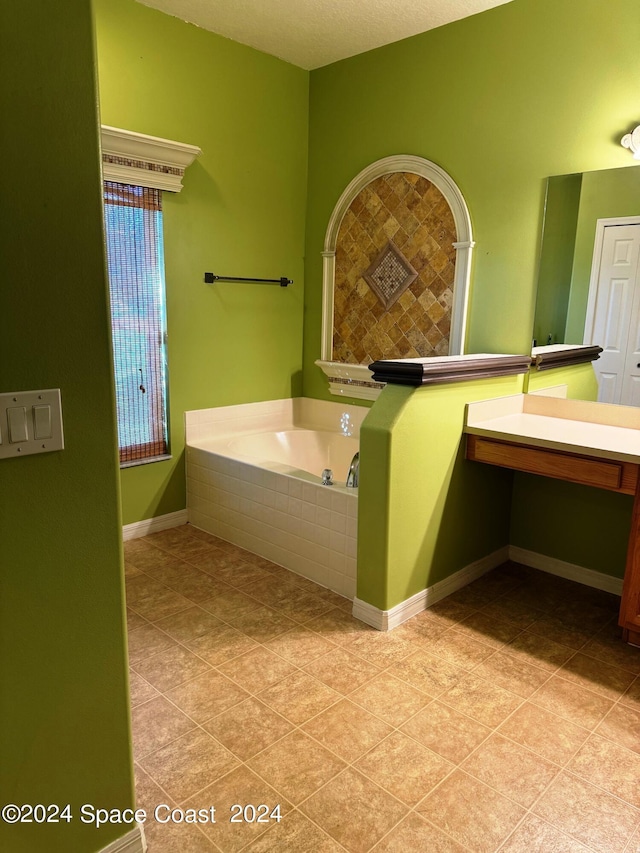 1870 Parrsboro St NW, Palm Bay, FL 32907 - full bath with vanity, a garden tub, tile patterned flooring, and baseboards