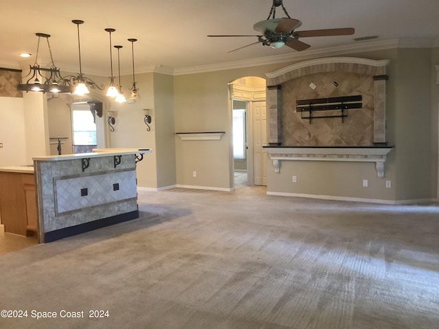 kitchen featuring carpet flooring, ornamental molding, ceiling fan, and pendant lighting