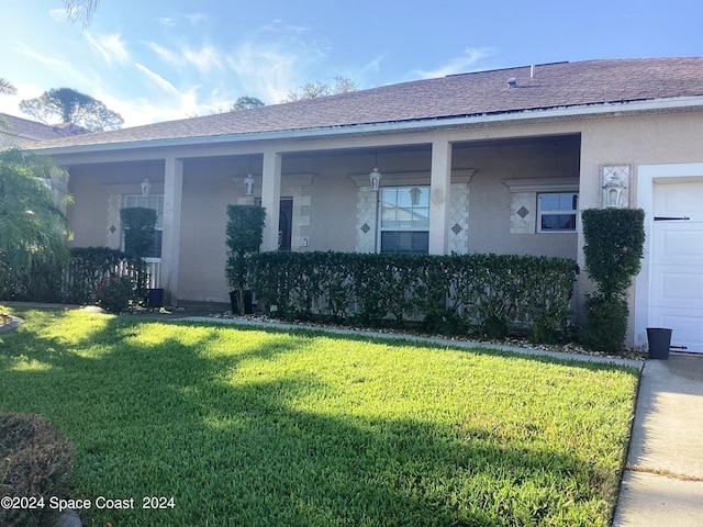 1870 Parrsboro St NW, Palm Bay, FL 32907 - back of house featuring a yard, a shingled roof, and stucco siding