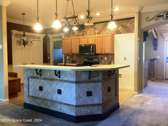 kitchen featuring black electric range, an island with sink, hanging light fixtures, a kitchen breakfast bar, and crown molding