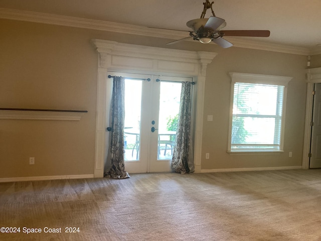 1870 Parrsboro St NW, Palm Bay, FL 32907 - carpeted spare room featuring a wealth of natural light, crown molding, ceiling fan, and french doors