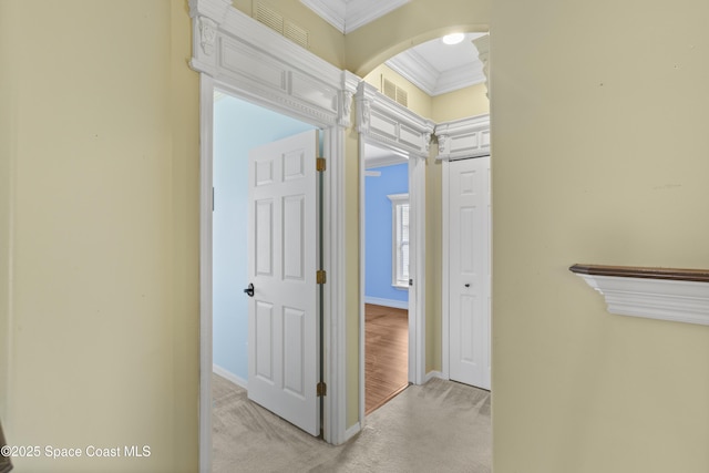 1870 Parrsboro St NW, Palm Bay, FL 32907 - hallway with ornamental molding, light colored carpet, and arched walkways