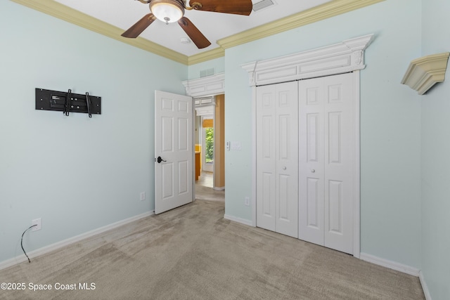 1870 Parrsboro St NW, Palm Bay, FL 32907 - unfurnished bedroom with carpet flooring, crown molding, a closet, and ceiling fan