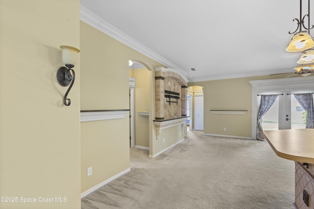 1870 Parrsboro St NW, Palm Bay, FL 32907 - kitchen with ornamental molding, french doors, carpet flooring, arched walkways, and a ceiling fan