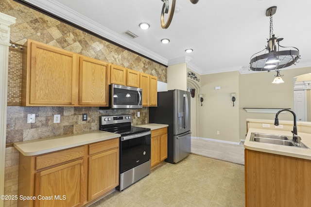 1870 Parrsboro St NW, Palm Bay, FL 32907 - kitchen featuring appliances with stainless steel finishes, crown molding, light countertops, backsplash, and hanging light fixtures