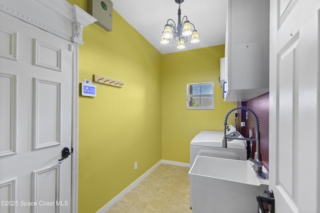 1870 Parrsboro St NW, Palm Bay, FL 32907 - laundry room with washer and dryer and a chandelier
