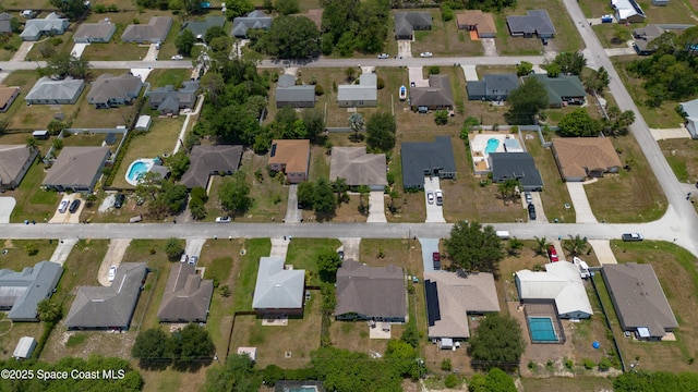 1870 Parrsboro St NW, Palm Bay, FL 32907 - aerial view of property and surrounding area with nearby suburban area and a pool