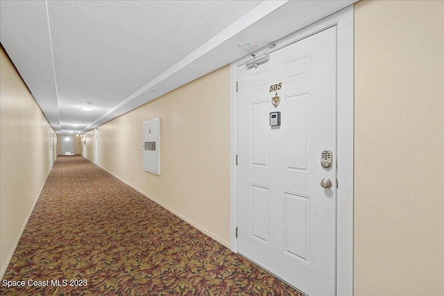 hallway with carpet floors