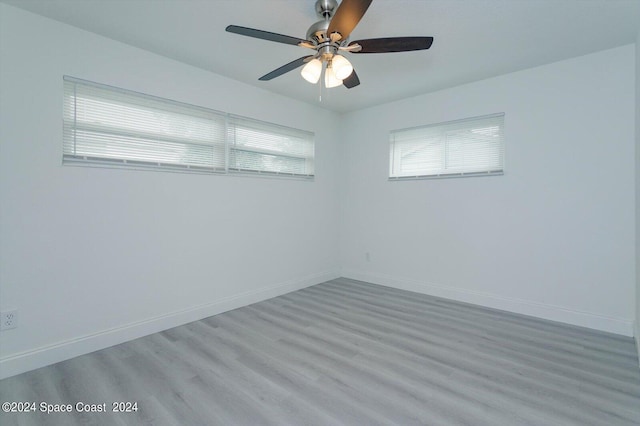 unfurnished room featuring ceiling fan and light wood-type flooring