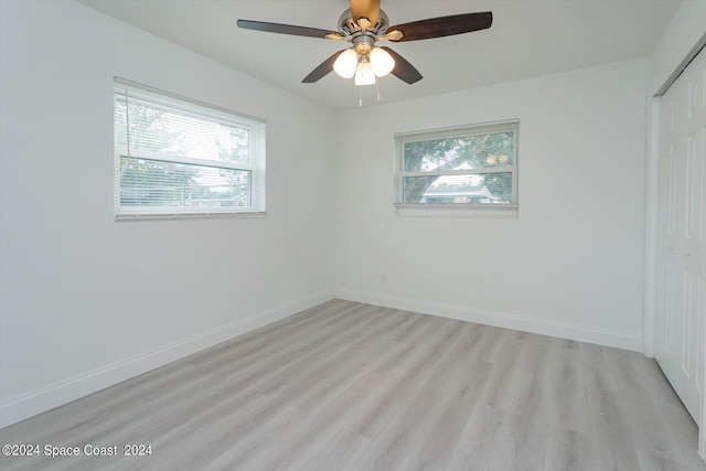 spare room with ceiling fan and light hardwood / wood-style flooring