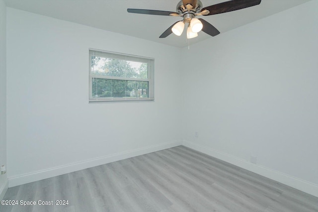 spare room with light hardwood / wood-style flooring and ceiling fan