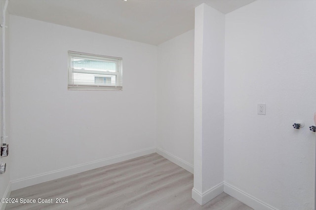 spare room featuring light wood-type flooring