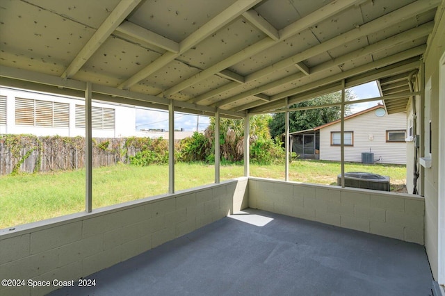 unfurnished sunroom with vaulted ceiling and a wealth of natural light