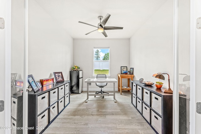 office space with ceiling fan and light hardwood / wood-style flooring