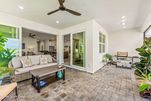 view of patio featuring an outdoor living space and ceiling fan