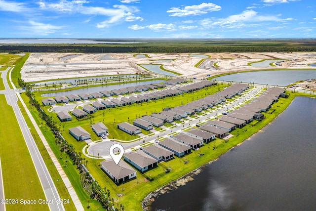 drone / aerial view featuring a water view