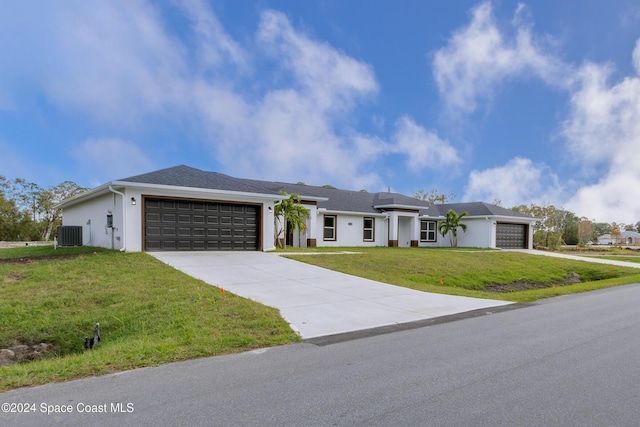 single story home with central AC, a garage, and a front lawn