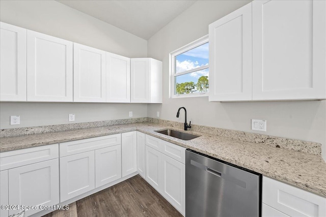 kitchen with dishwasher, white cabinetry, and sink