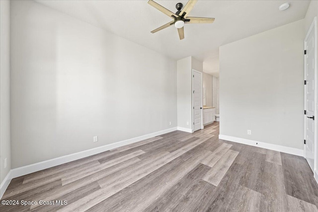 unfurnished room featuring light wood-type flooring and ceiling fan