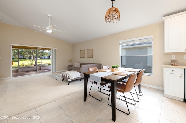 dining space featuring vaulted ceiling, ceiling fan, and light tile patterned floors