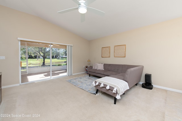 carpeted living room with vaulted ceiling and ceiling fan