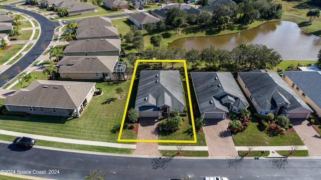 birds eye view of property featuring a water view