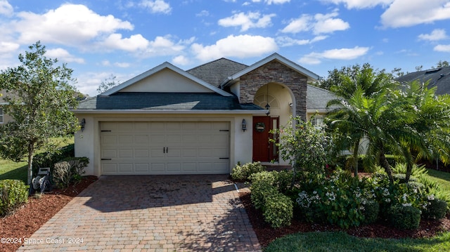 ranch-style home featuring a garage