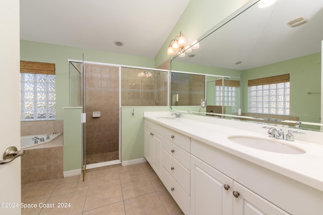 bathroom featuring shower with separate bathtub, vanity, and tile patterned floors