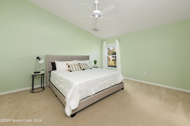 carpeted bedroom featuring vaulted ceiling and ceiling fan