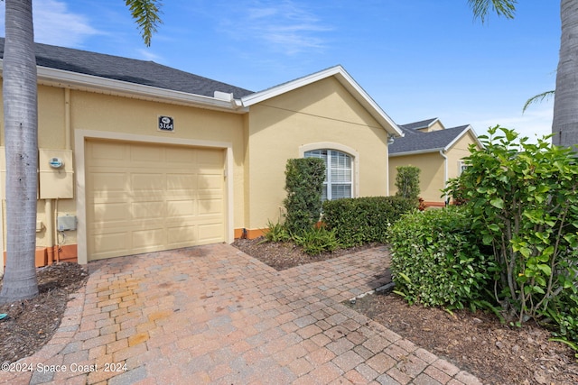 single story home featuring a garage