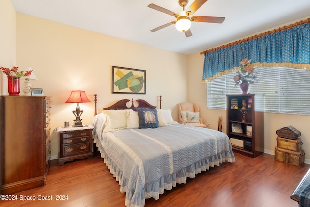 bedroom with wood-type flooring and ceiling fan