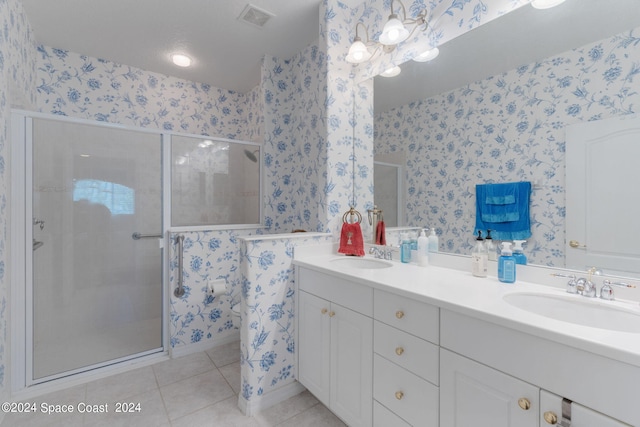 bathroom with vanity, tile patterned floors, and a shower with shower door