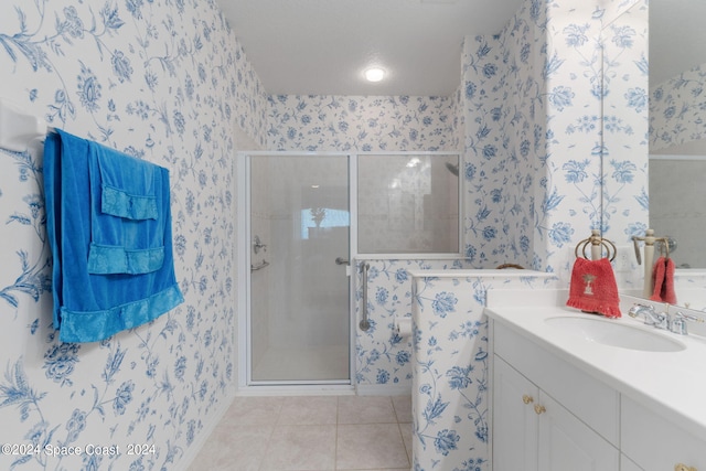 bathroom with vanity, tile patterned flooring, and an enclosed shower