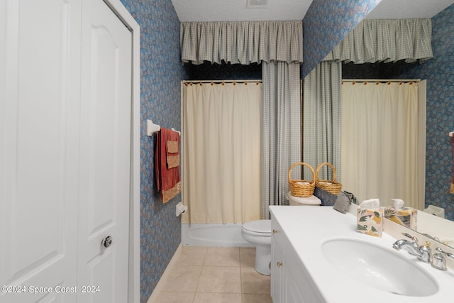 full bathroom with vanity, toilet, shower / bath combo, a textured ceiling, and tile patterned flooring